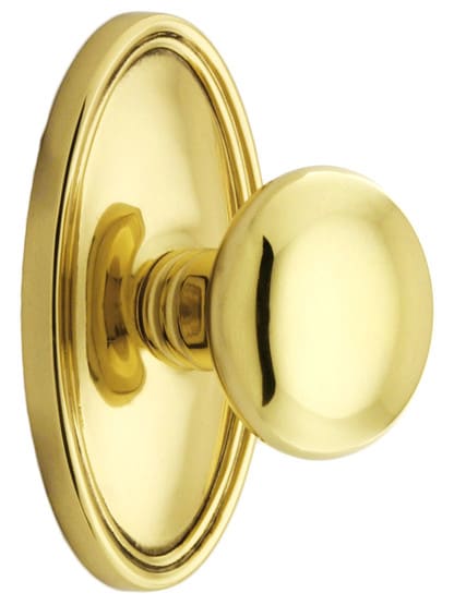 Oval Rosette Set With Providence Knobs in Polished Brass.
